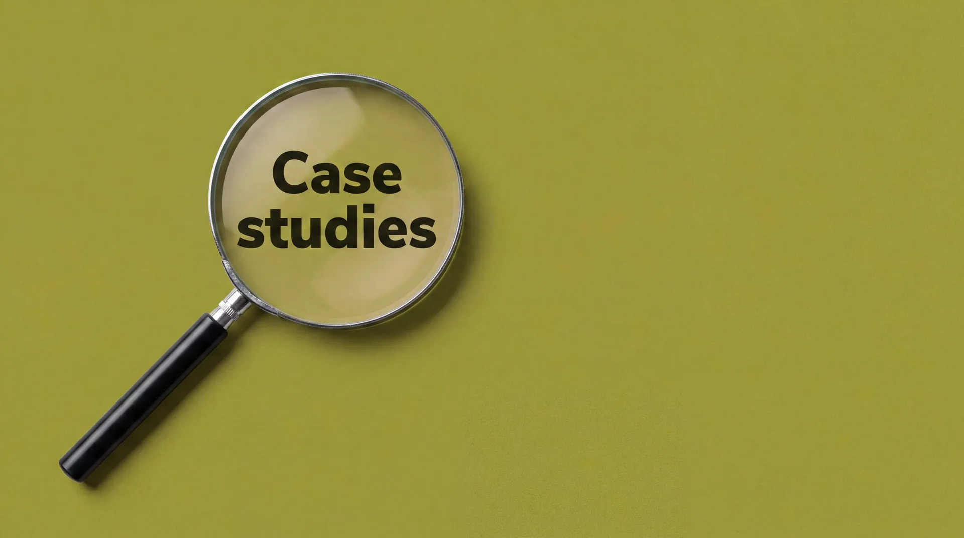 A black magnifying glass lying diagonally on a muted Tactical Olive surface, the lens enlarging the stacked words 'Case studies' in bold black sentence-case text, editorial product photograph in the ROZOR brand palette.